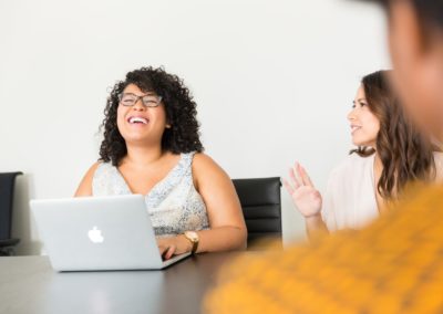 woman sitting in front of the laptop